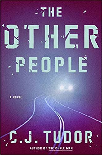 Cover of "The Other People" with the title and author C. J. Tudor's name over a curvy road, with car headlights in the background.