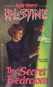 Cover of "The Secret Bedroom," with the title in red font over an illustration of a short-haired white girl in blue turtleneck and jeans holding a partially open door against a skeletal hand that's trying to shut it. In the room with the hand, there's a green glow.