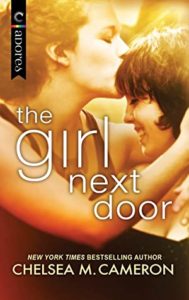 Cover of "The Girl Next Door," with a white woman kissing another woman's forehead in semi closeup
